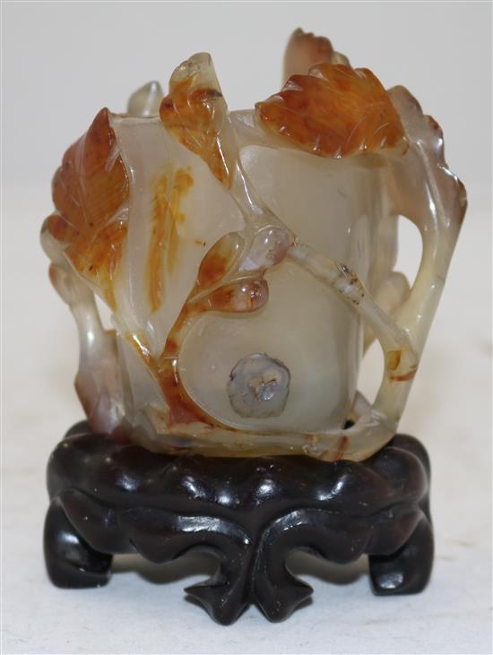 A Chinese chalcedony cup, 19th century, Qing dynasty, 8.2cm, ebonised wood stand